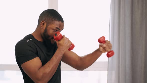 Determined Male Fit Sportsman Exercising at Home