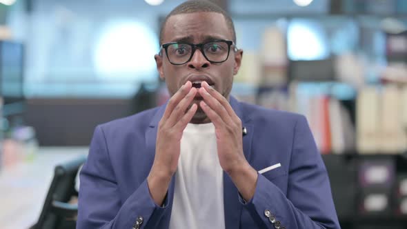 Portrait of African Businessman Feeling Shocked