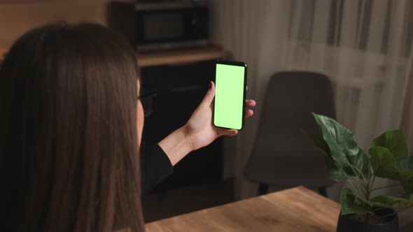 Woman talking a video call green screen smartphone