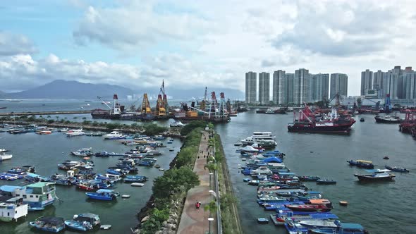 Drone shot of Typhoon shelter in Tuen Mun, Hong Kong where yacht, ships are seen idling on the sea