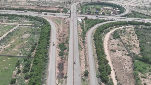 Aerial View Along Super Highway In Pakistan. Dolly Forward Tilt Up