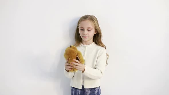 A Child with a Bear in Her Hands a Little Girl Holds a Teddy Bear in Her Hands