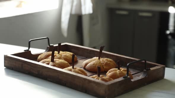 desk with pumpkin shape cookies at kitchen