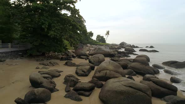 A low flying drone over the beach at Shamrock beach in Penang, malaysia.