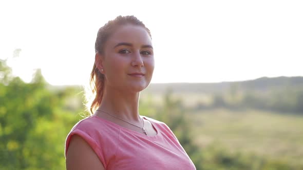 Athletic girl practicing yoga at sunset