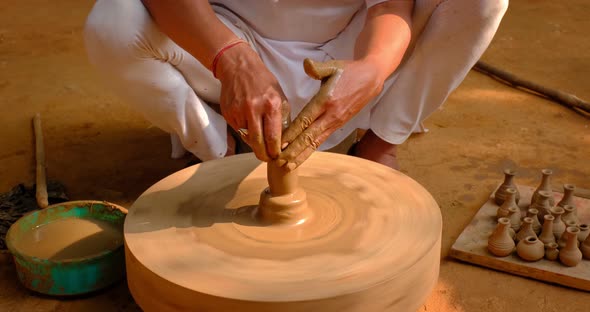 Skilled Hands of Potter Shaping the Clay on Potter Wheel and Sculpting Clay Pot Jar, Shilpagram