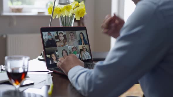 Unrecognizable African American Man Using Business Video Chat on Laptop Working Remotely on