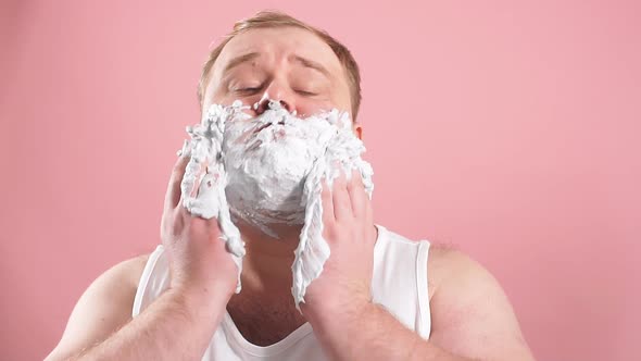 Funny Fat Middle-aged Man in T-shirt While Applying Facial Shaving Foam, Slow Motion