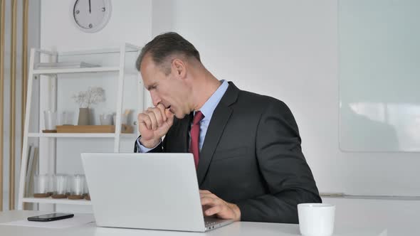 Middle Aged Businessman Coughing at Work, Cough and Throat Soar