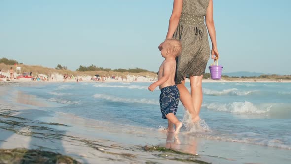 Happy Child Looking Around at Seashore