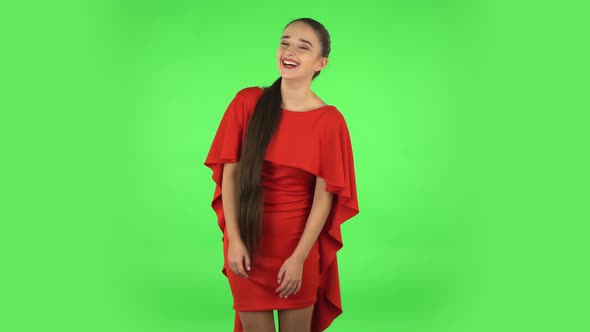 Pretty Young Woman Is Laughing. Green Screen