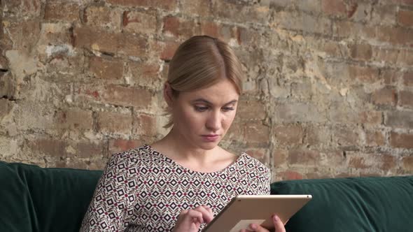 Woman uses tablet pc internet web surfing, girl, beautiful girl touches computer