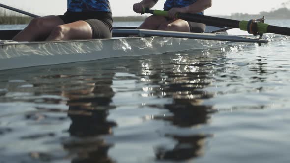 Female rowing team training on a river