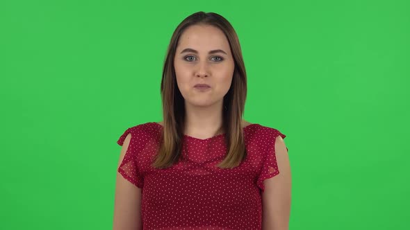 Portrait of Tender Girl in Red Dress with Shocked Surprised Wow Face Expression. Green Screen