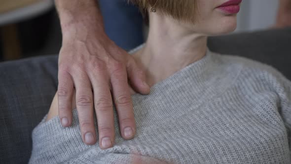 Unrecognizable Slim Young Woman Touching Male Hand on Shoulder Closeup