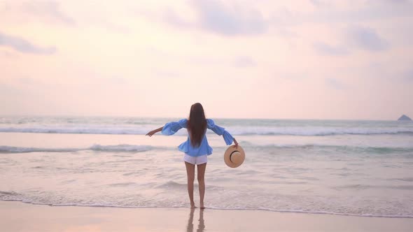 Asian woman enjoy around beautiful beach sea ocean