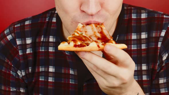 Unrecognizable Young Man Eating Pizza