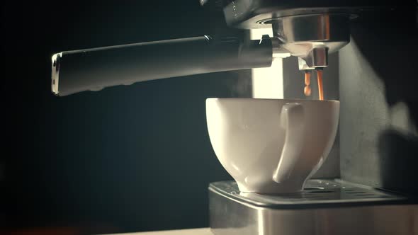 Pouring Coffee Stream From Machine in Cup