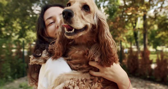 Woman Playing with Her Dog