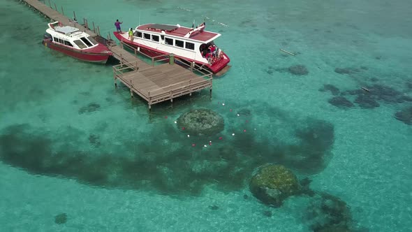 Drone footage from Malaysia island. Beach side tropical season feel.