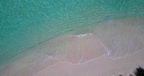 Tropical flying abstract shot of a white sand paradise beach and aqua turquoise water background in 