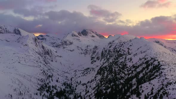 Aerial video of mountain peaks during the winter