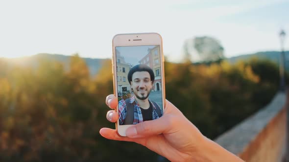 Man Speaking on Video Call on Smartphone