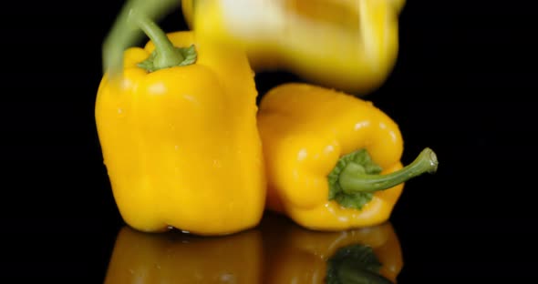 Half Yellow Sweet Pepper Falling Into Water with a Splash. 