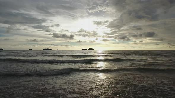 Aerial view of calm waves breaking during sunset, Ko Chang, Thailand.