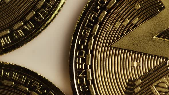 Rotating shot of Bitcoins (digital cryptocurrency) - BITCOIN MONERO
