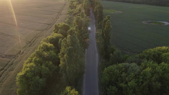 Aerial View Road Near Field At Sunset