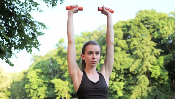 Portrait of Slim Woman Professional Athlete Trainer During Workout Outdoor