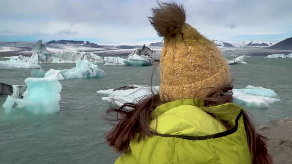 Tourist on Iceland Looking at Jokulsarlon Glacier Lagoon