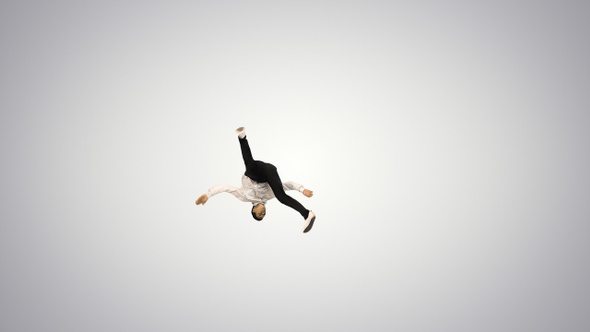 Young energetic businessman doing several flips on gradient