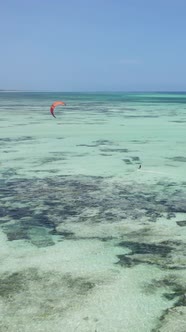 Tanzania  Vertical Video Kitesurfing Near the Shore of Zanzibar Slow Motion