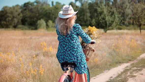 Woman Hair Fluttering. Cyclist Girl Wearing Dress Workout. Cyclist Happy Woman. Cycling On Bike.