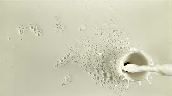 A Stream of Milk Flows with Air Bubbles