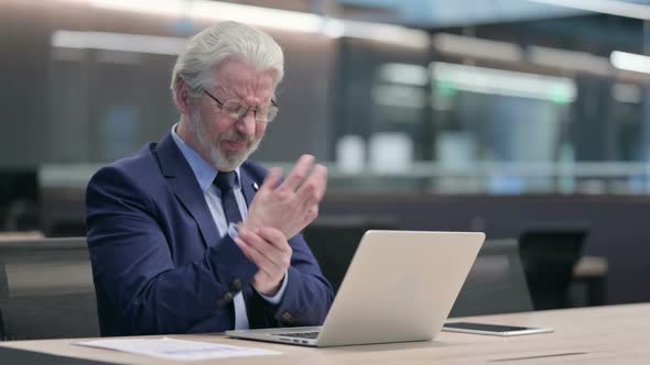 Old Businessman with Laptop Having Wrist Pain