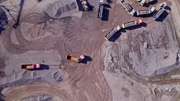 The Excavator Loads the Crushed Stone in a Truck