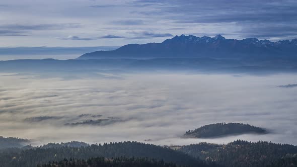 Stunning sunrise with flowing clouds in the Tatra mountains , Poland, Timelapse