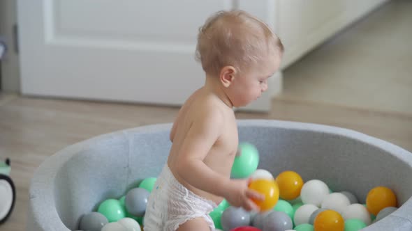 Kid Playing in Ball Pit at Home