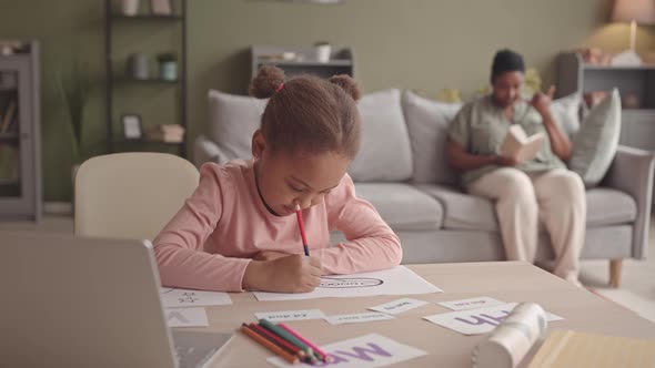 Little Girl Studying at Home