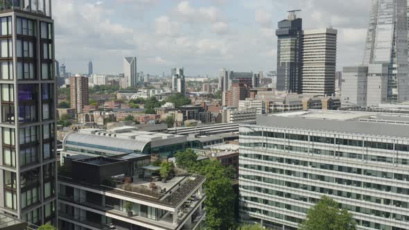 London Metropolis. Flying in Between Modern Looking Buildings