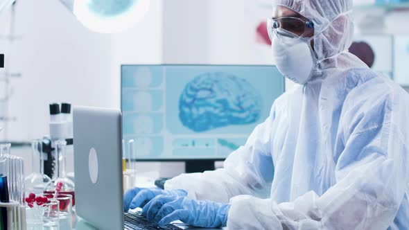 Dolly Shot of Professional Researcher Working in Modern Laboratory