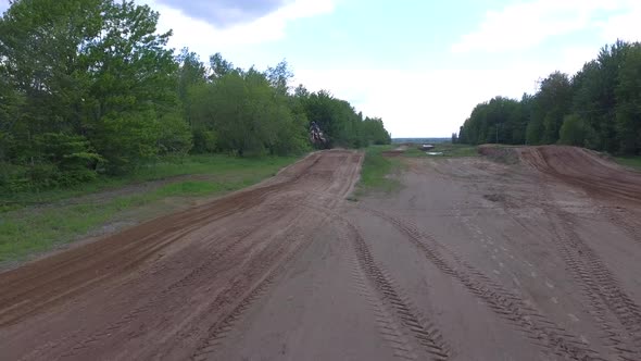 aerial motocross racer jumping close up 4k