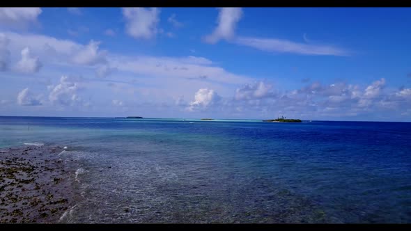 Aerial drone view travel of exotic tourist beach vacation by aqua blue sea with white sand backgroun