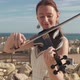 Red-haired woman is playing the violin - VideoHive Item for Sale