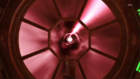 Spaceship Flying Through Hyperspace Light Speed Tunnel Color Red