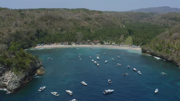 tropical white sand beach at crystal bay in nusa penida island, bali, aerial