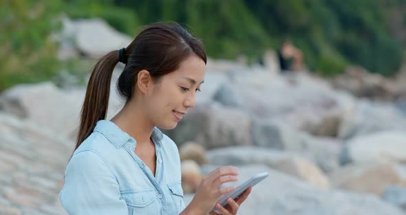 Woman use of mobile phone online